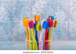 toothbrushes-ceramic-bowl-on-blurred-260nw-2503736943